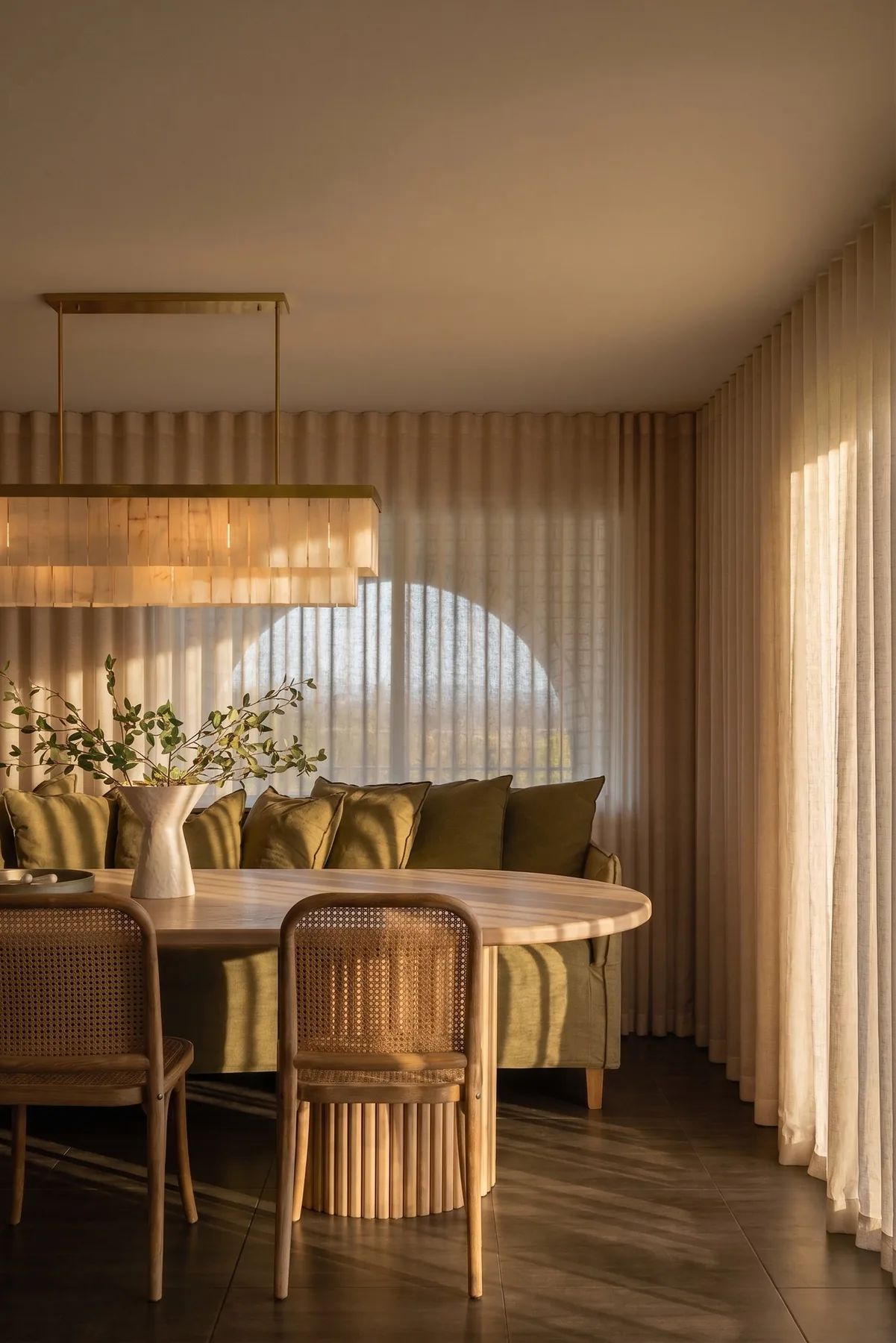 A dining room set under a pendant light