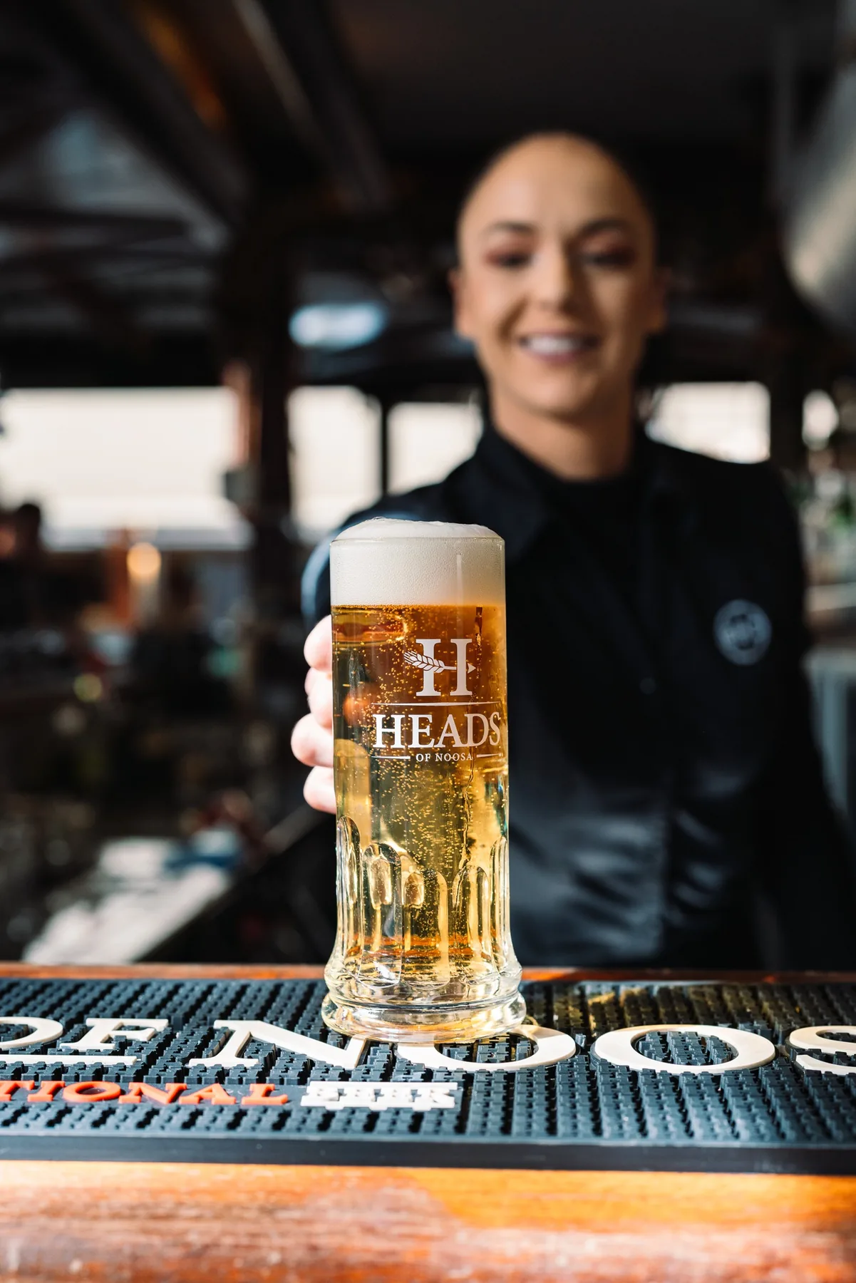 A cold beer poured behind the bar